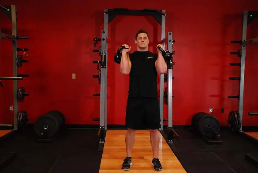 Alternating Kettlebell Press exercise