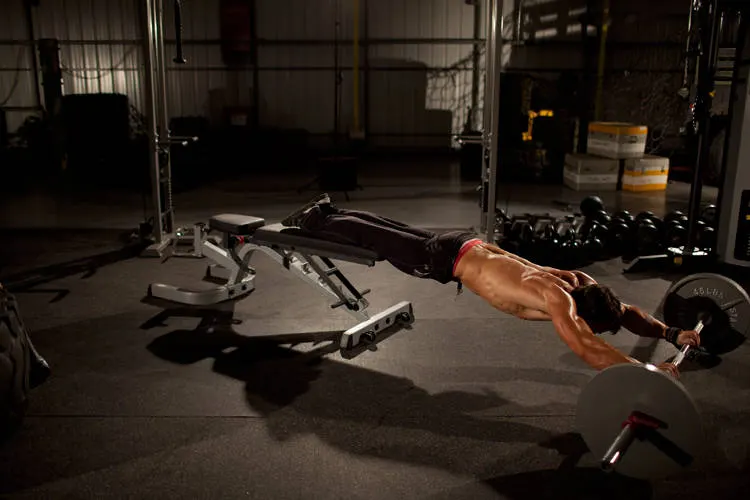 Barbell Rollout from Bench — end position
