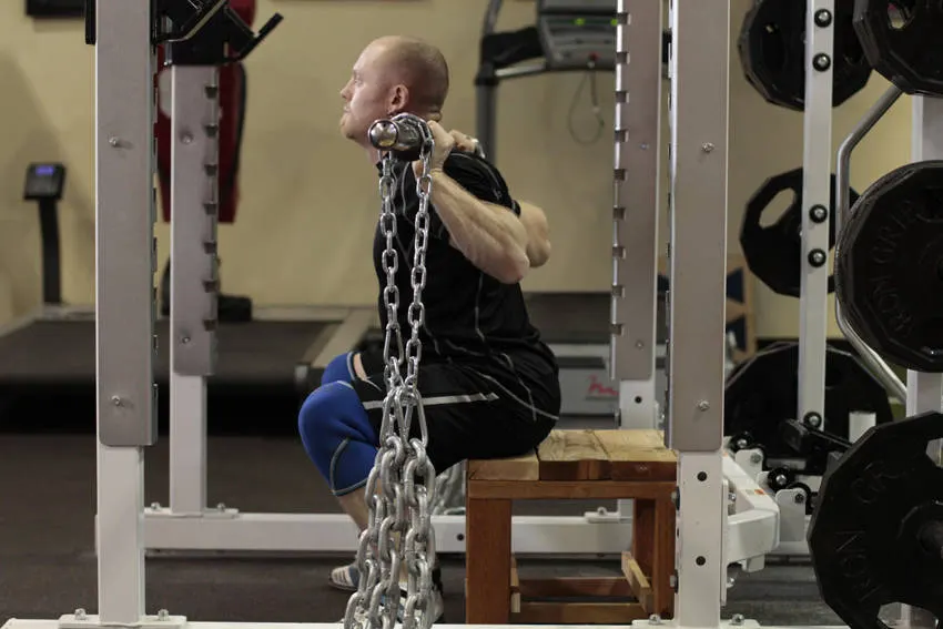 Box Squat with Chains — end position