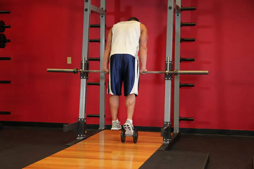 Calf Raise On A Dumbbell — end position