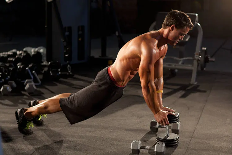 Close-Grip Push-Up off of a Dumbbell exercise
