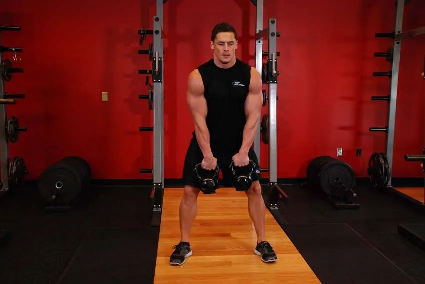 Double Kettlebell Alternating Hang Clean exercise