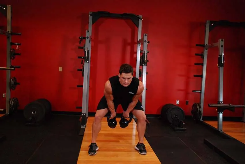 Double Kettlebell Snatch — end position