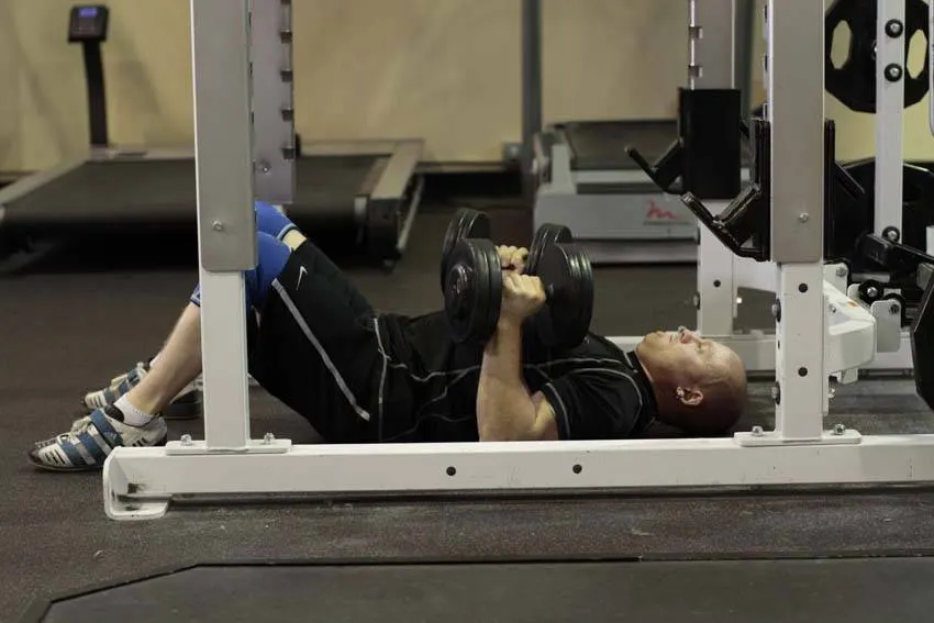 Dumbbell Floor Press — end position