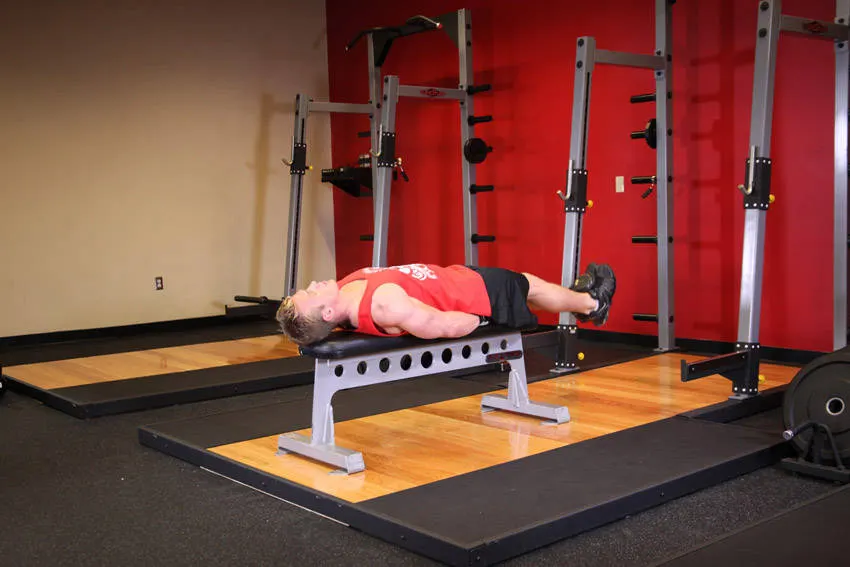 Flat Bench Lying Leg Raise exercise