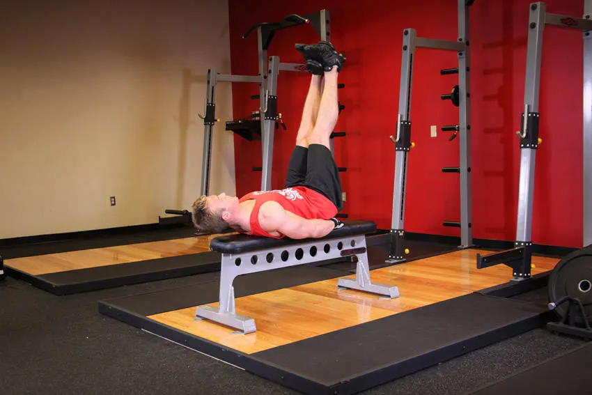 Flat Bench Lying Leg Raise — end position