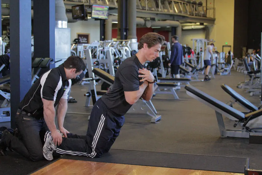 Floor Glute-Ham Raise — end position