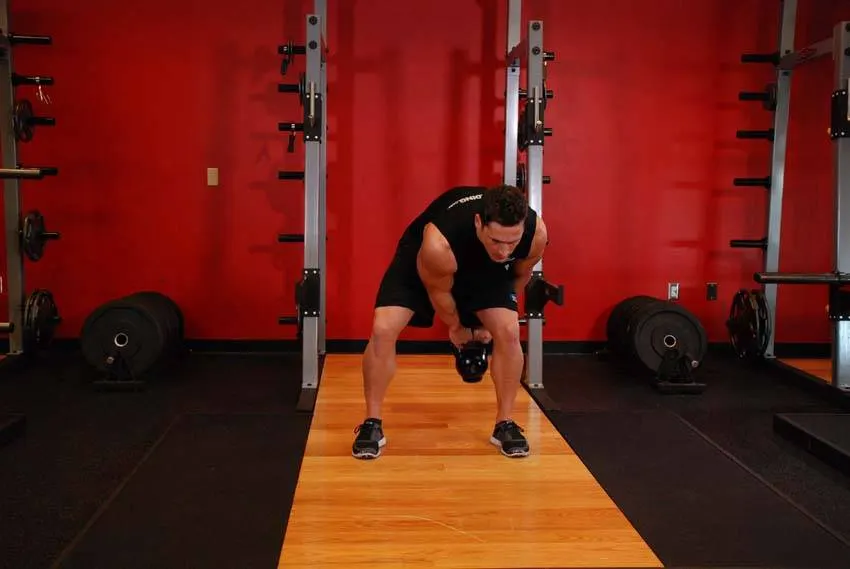 Kettlebell Pass Between The Legs — end position