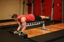 Lying High Bench Barbell Curl exercise