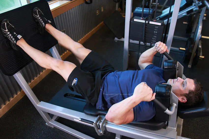 Lying Machine Squat — end position