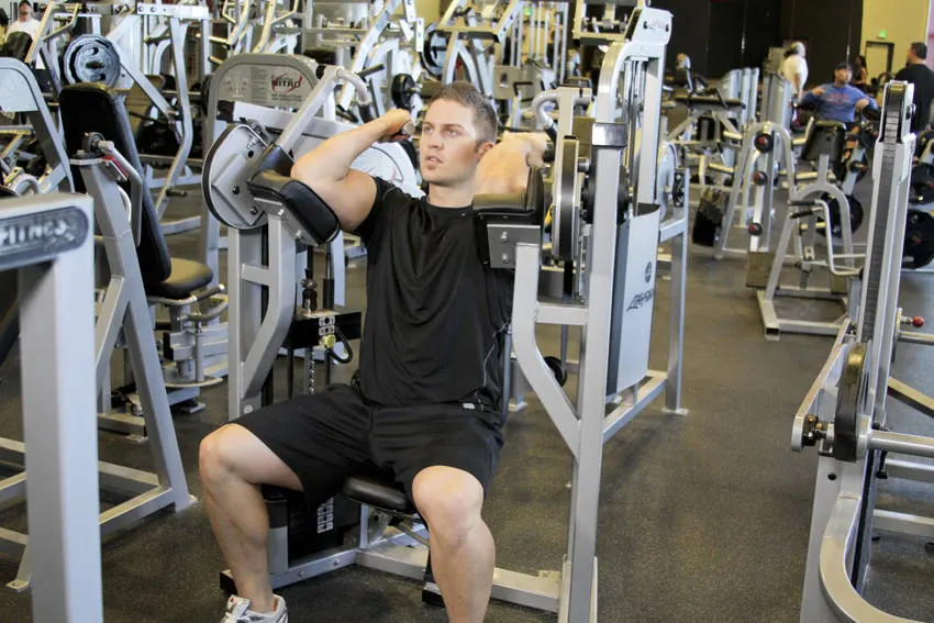 Machine Bicep Curl — end position