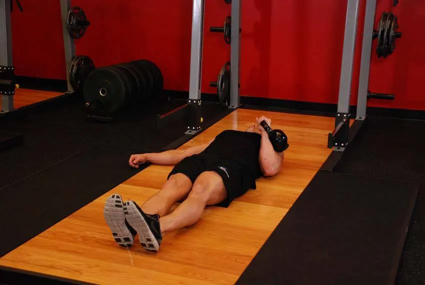 One-Arm Kettlebell Floor Press exercise