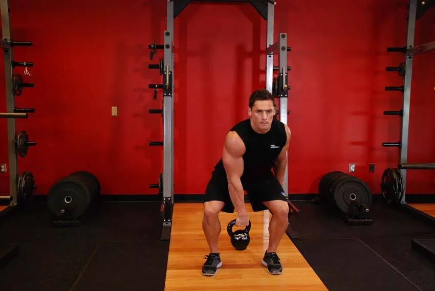 One-Arm Kettlebell Split Snatch — end position