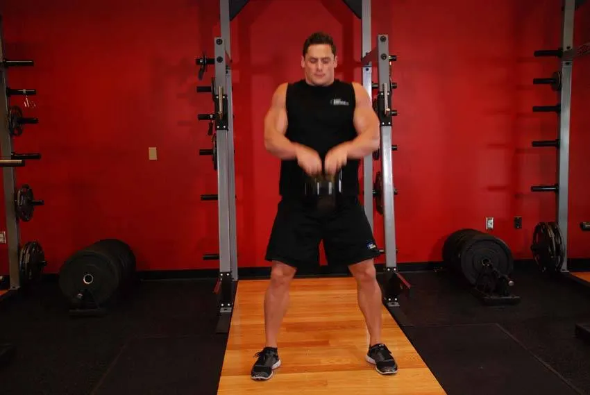Open Palm Kettlebell Clean — end position