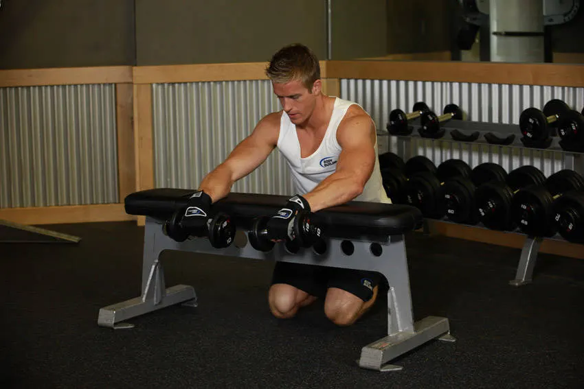 Palms-Down Dumbbell Wrist Curl Over A Bench exercise