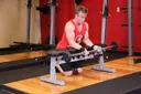 Palms-Up Barbell Wrist Curl Over A Bench exercise