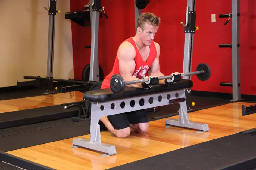 Palms-Up Barbell Wrist Curl Over A Bench — end position