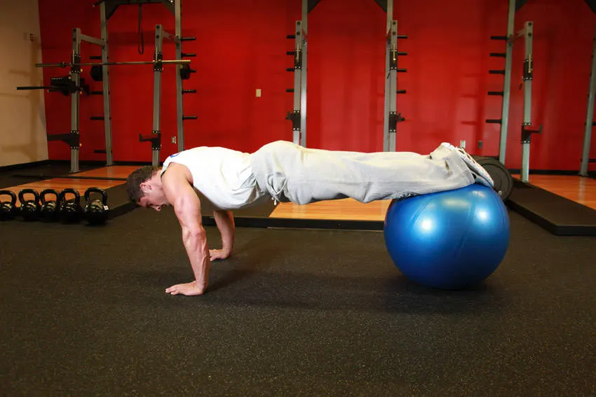 Push-Ups With Feet On An Exercise Ball — end position