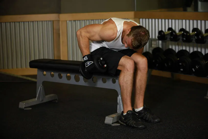 Seated Bent-Over One-Arm Dumbbell Triceps Extension exercise