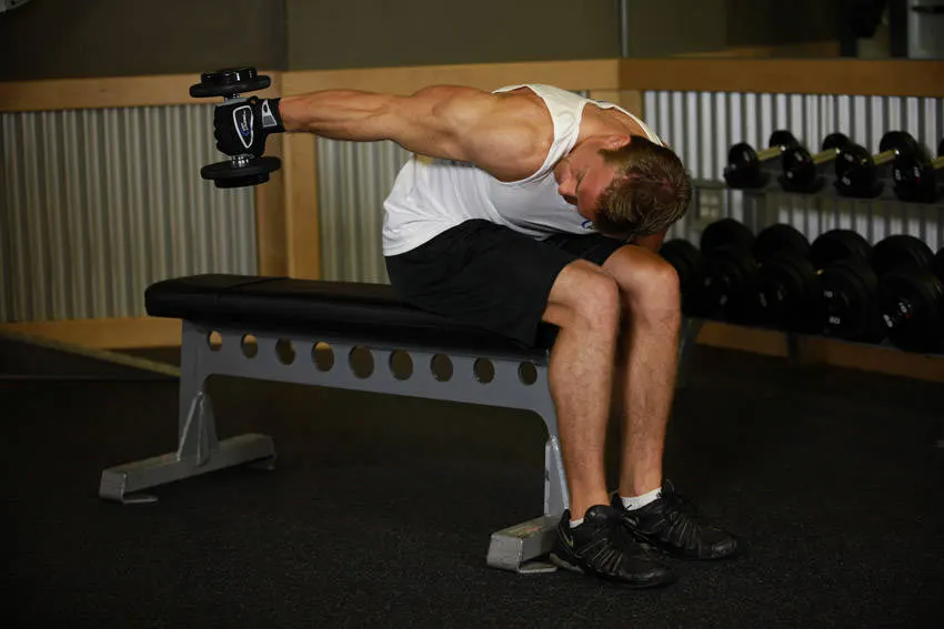 Seated Bent-Over One-Arm Dumbbell Triceps Extension — end position