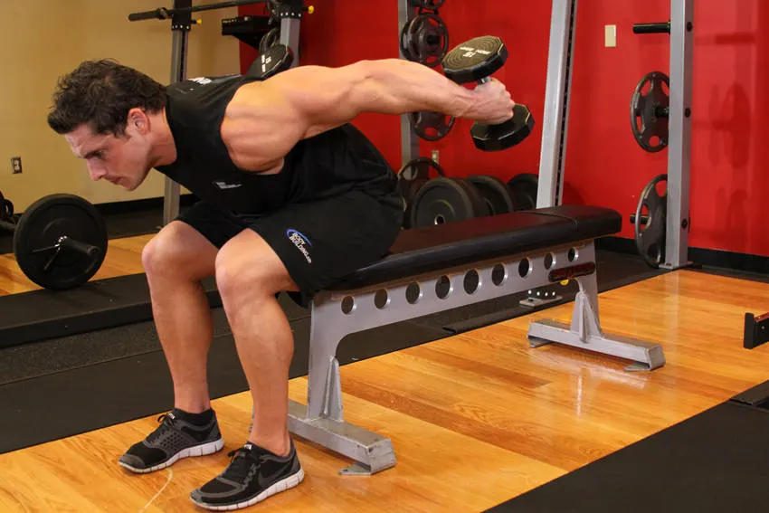 Seated Bent-Over Two-Arm Dumbbell Triceps Extension — end position