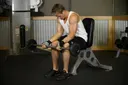 Seated Palm-Up Barbell Wrist Curl exercise