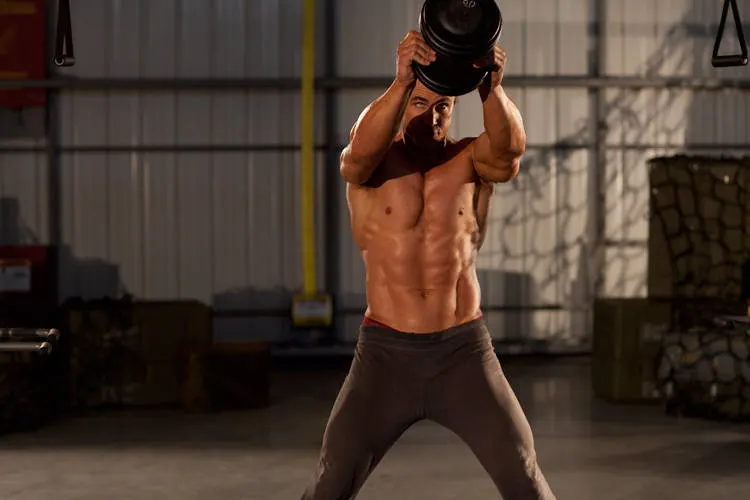 Single Dumbbell Raise — end position
