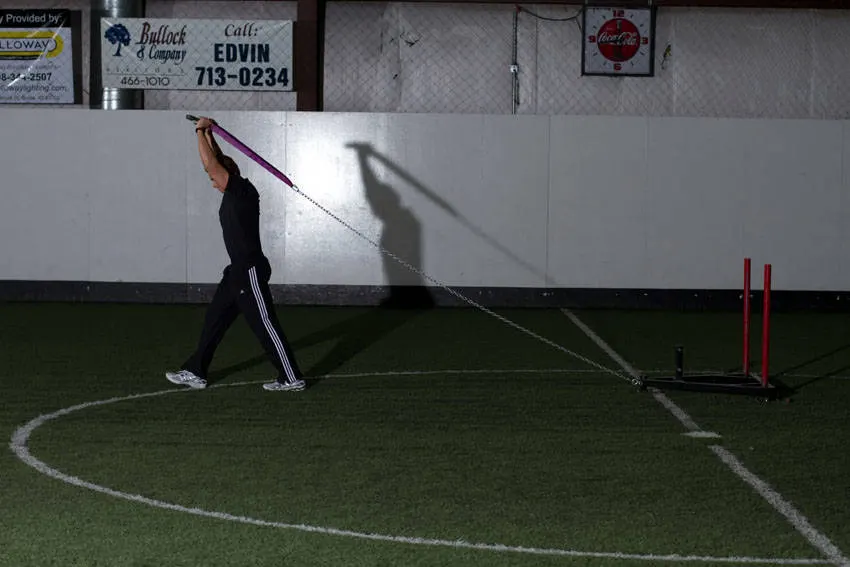 Sled Overhead Triceps Extension — end position