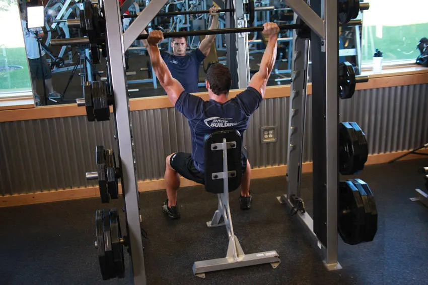 Smith Machine Overhead Shoulder Press — end position
