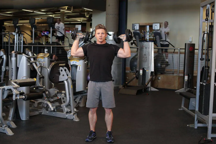 Standing Alternating Dumbbell Press — starting position