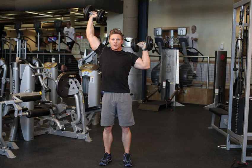Standing Alternating Dumbbell Press — end position