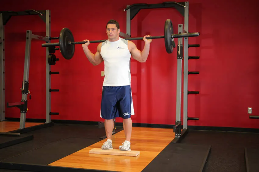 Standing Barbell Calf Raise — end position