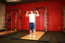 Standing Barbell Press Behind Neck exercise