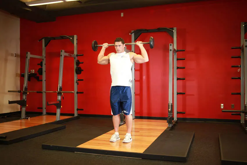 Standing Barbell Press Behind Neck — starting position