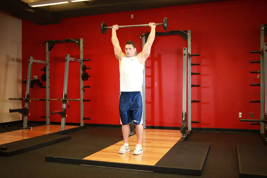 Standing Barbell Press Behind Neck — end position