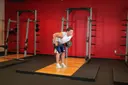 Standing Bent-Over Two-Arm Dumbbell Triceps Extension exercise