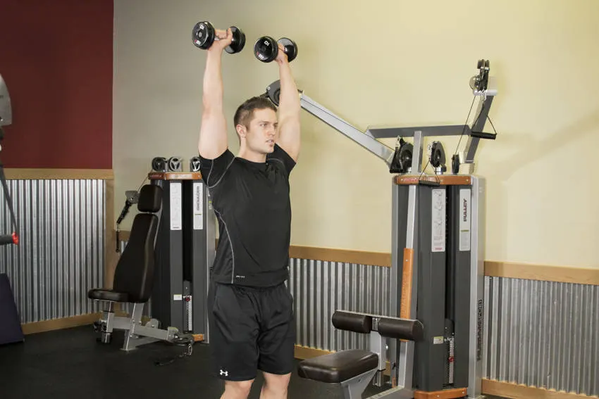 Standing Dumbbell Press — end position