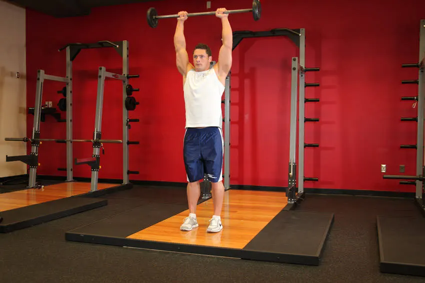 Standing Front Barbell Raise Over Head — end position