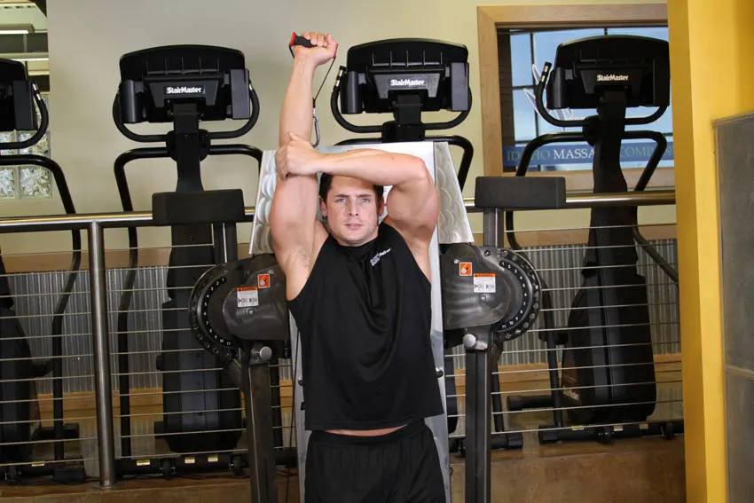 Standing Low-Pulley One-Arm Triceps Extension — end position