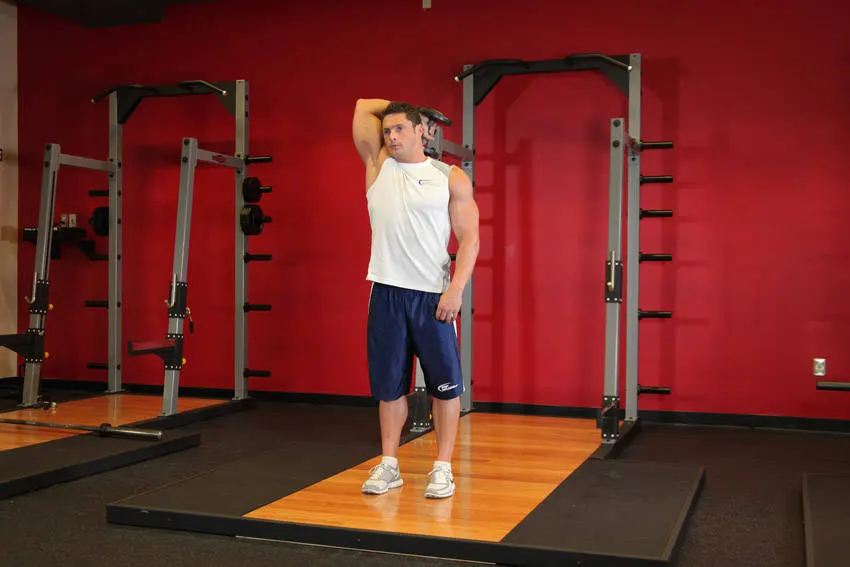Standing One-Arm Dumbbell Triceps Extension — end position