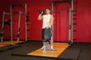 Standing Palm-In One-Arm Dumbbell Press exercise