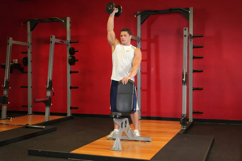 Standing Palm-In One-Arm Dumbbell Press — end position