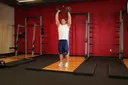 Standing Palms-In Dumbbell Press exercise