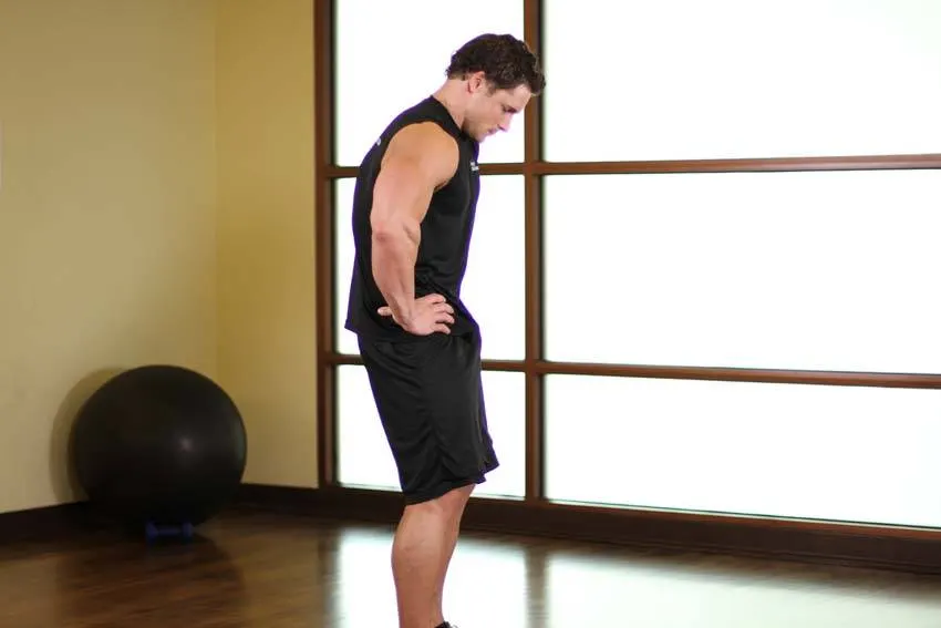 Standing Pelvic Tilt — end position