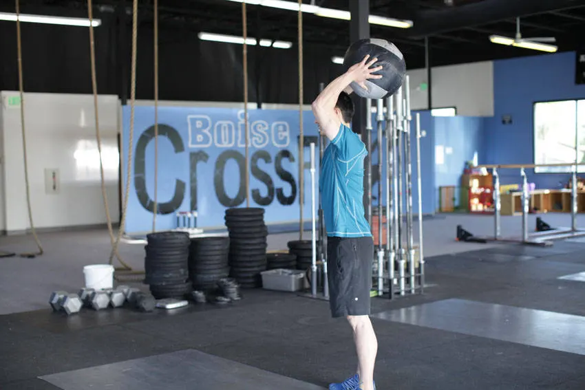Standing Two-Arm Overhead Throw — end position