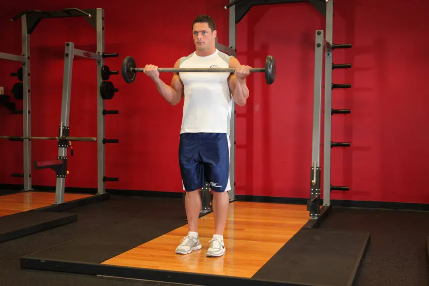 Wide-Grip Standing Barbell Curl — end position
